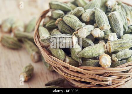 Dried okra (ladies' fingers, ochro) in woven basket Stock Photo