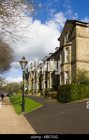 Broad Walk, Buxton, Victorian terraced townhouses face towards the adjacent Pavilion Gardens. Stock Photo