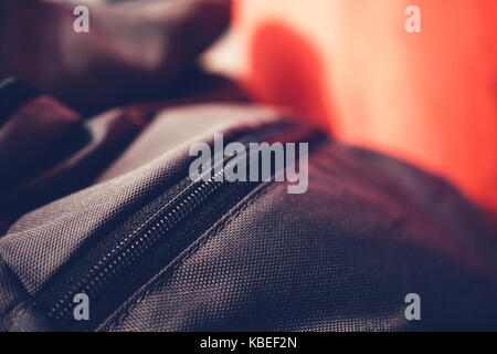 Close-Up Of Olive Green Backpack With Black Zipper Placed Near Train Window While Traveling Stock Photo