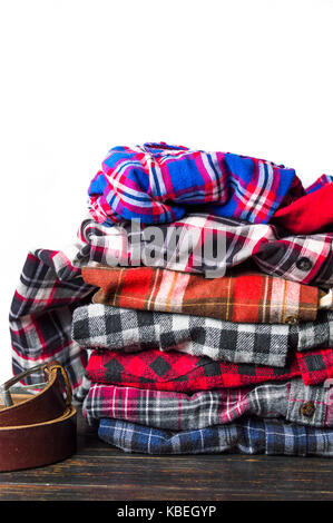 Colorful plaid male shirts on a pile Stock Photo
