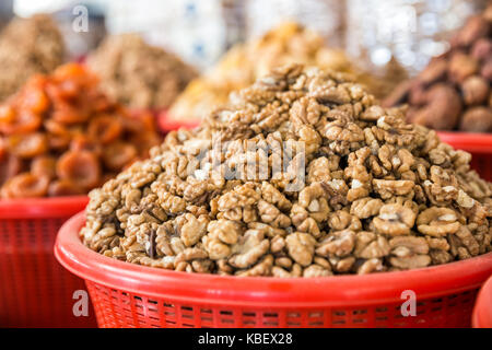 Peeled walnuts on the market counter close up Stock Photo