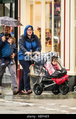 Aberystwyth, Wales, UK, Saturday 30 September 2017 UK Weather: Torrential rain pours down on pedestrians sheltering under their umbrellas in Aberystwyth inWest Wales. Storm Brian, the second named storm of the season, is expected to bring more rain and gale force winds to the west and north of the UK on Sunday and Monday. Yellow warnings have ben issued by the Met Office Photo Credit: Keith Morris/Alamy Live News Stock Photo