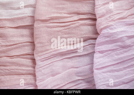 Pink color drapery cloth textile texture abstract background Stock Photo