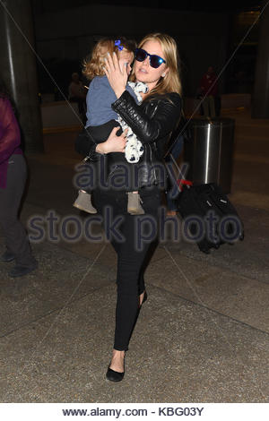 Holly Valance and her daughter arrive at Los Angeles International ...