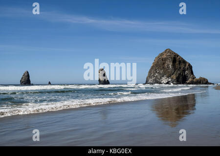 Cannon Beach in northwest Oregon. The beach is known for its long, sandy shore as well as Haystack Rock formation. The beach also featured in the 1980 Stock Photo