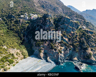 Aerial view of Nonza and tower on a cliff overlooking the sea, black beach and sea. Cap Corse Peninsula, Corsica. Coastline. France Stock Photo
