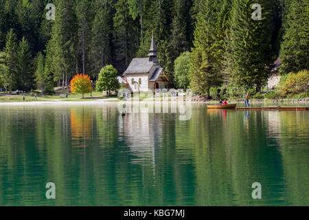 Tourists on boats on Lake Braies, South Tyrol, Italy Stock Photo