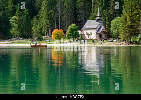 Tourists on boats on Lake Braies, South Tyrol, Italy Stock Photo