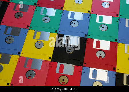 Multicolored floppy disc 3.5 5.1/4 for old computers. Aligned as background. Stock Photo