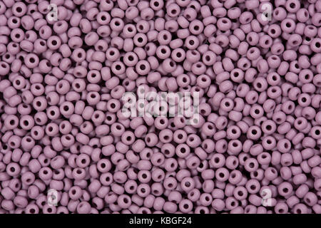 Background of purple seed beads.  Stock Photo