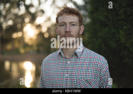 Portrait of farmer standing in the field Stock Photo