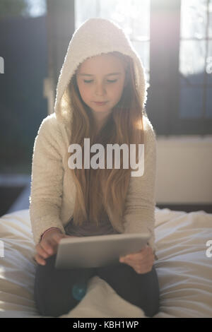 Girl using digital tablet at home Stock Photo