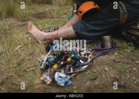 Low section of man relaxing on grass Stock Photo