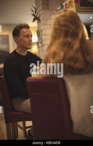 Couple having a conversation in the kitchen at home Stock Photo