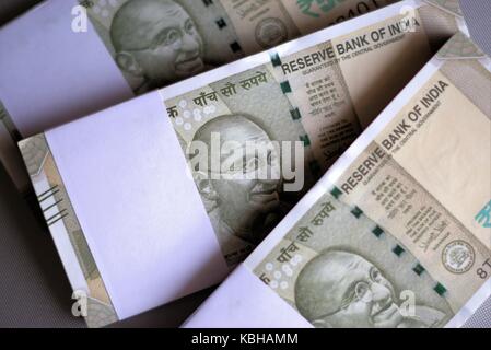 Indian bank notes of five hundred rupees. Bundles of Indian currency. Wads of Indian rupees. Selective focus. Stock Photo