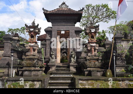 Typical balinese offerings on the street in Ubud, Bali - Indonesia Stock Photo