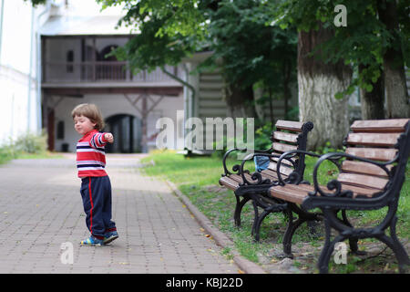 boy kid bench parl alone Stock Photo