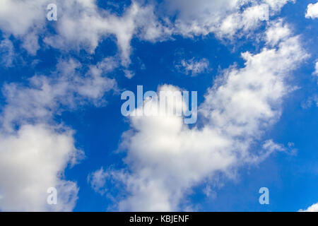 Fantastic soft white clouds against blue sky background - Stock