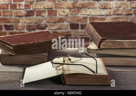 Old books on wooden table Stock Photo