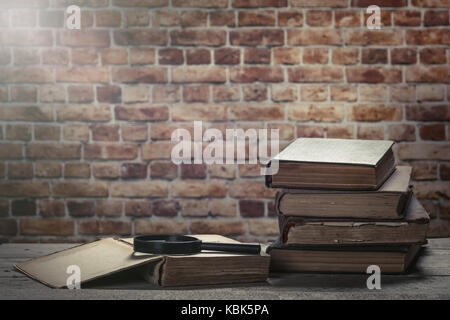 Old books on wooden table Stock Photo