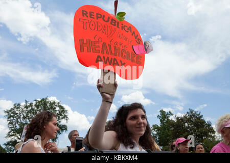 June 27, 2017: Liberals protest outside of US Capitol building to save Obamacare (Affordable Care Act), Medicare, and Medicaid - Washington, DC USA Stock Photo