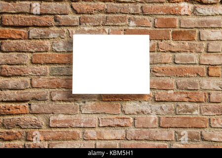 Empty information sign on old brick wall. White color Stock Photo