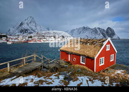 Traditional red rorbu house in Reine village on Lofoten Islands, Stock Photo