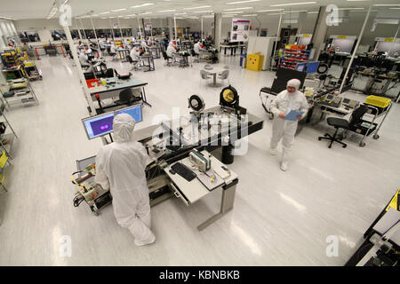 Scientists working in clean room environment Stock Photo