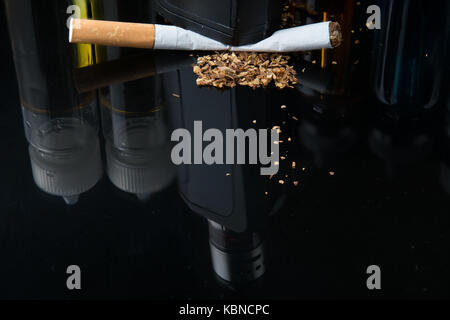 Modern vaporiser versus old tobacco cigarette Stock Photo