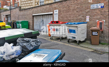 BRISTOL ENGLAND CITY CENTRE THERE AND BACK AGAIN LANE CROWDED WITH RUBBISH BINS Stock Photo