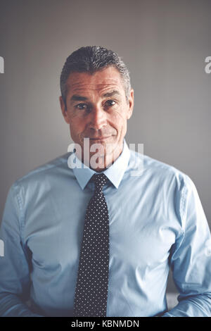 Mature Businessman Wearing A Shirt And Tie Stock Photo - Alamy