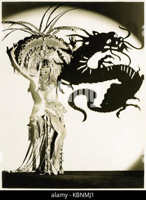 Anna May Wong (1905-1961), the original Dragon Lady (a derogatory stereotypical East Asian sly and deceitful lady); in publicity photograph promoting ‘Daughter of the Dragon’ (1931) in which she played Ling Moy, the daughter of Fu Manchu. See more information below. Stock Photo