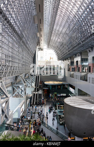 Kyoto station. Massive building designed by Hiroshi Hara. View from high floor at one end looking along interior of station, with roof and concourse. Stock Photo