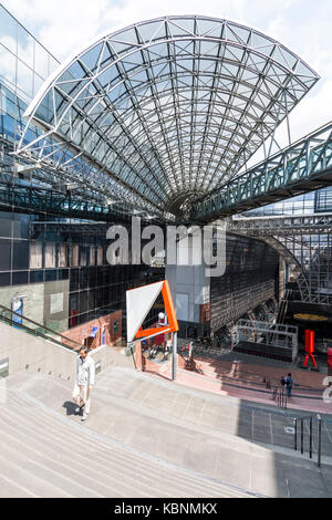Kyoto station. Massive building designed by Hiroshi Hara. View from high floor at one end looking along interior of station, with glass and steel roof Stock Photo