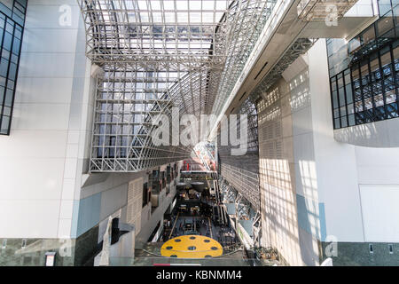 Kyoto station. Massive building designed by Hiroshi Hara. View from high floor at one end looking along interior of station, with roof and concourse. Stock Photo