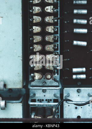 Old capacitors part of radio printed circuit board Equipment Stock Photo