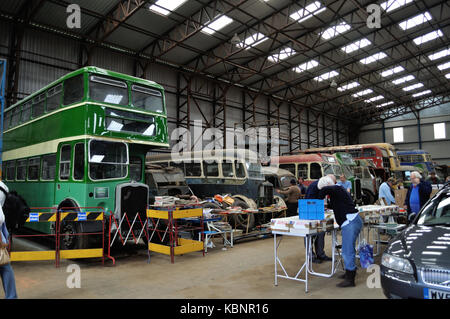 A view inside the hangar at the former RAF Winkleigh at the WETC Open Day on 6/10/13 showing several buses awaiting restoration and various traders. Stock Photo