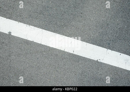 Road Asphalt Texture with Diagonal White Stripe Mark Stock Photo