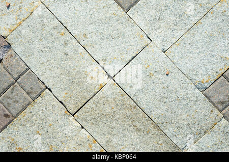 Pavement Tiles from Granite Stone. The Texture of Natural Stone in the Decoration of Street Spaces Stock Photo