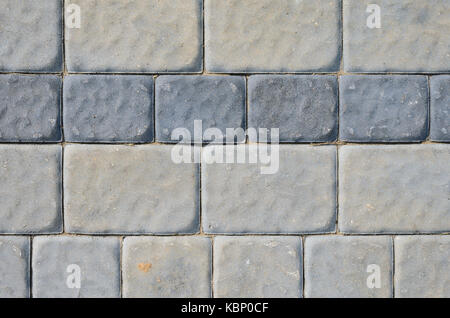 The Texture of the Gray Paving Stone from Artificial Stones. Gray Sidewalk Texture Stock Photo