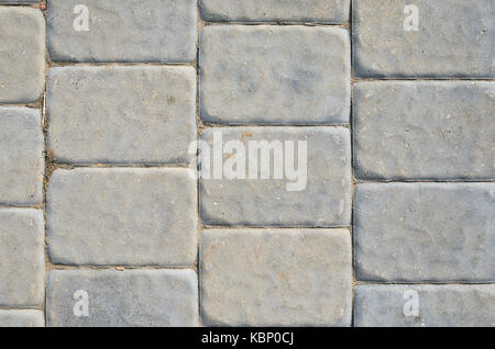 The Texture of the Gray Paving Stone from Artificial Stones. Gray Sidewalk Texture Stock Photo