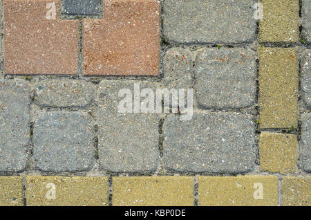 Multicolored Sidewalk Tile Texture. The Texture of Artificial Stone Pavers of Different Colors Stock Photo