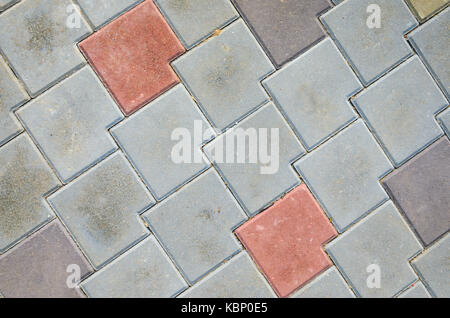 Multicolored Sidewalk Tile Texture. The Texture of Artificial Stone Pavers of Different Colors Stock Photo