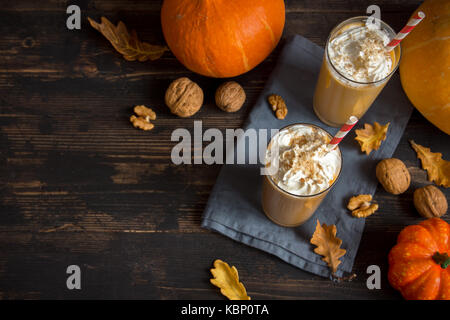 Pumpkin Smoothie. Fresh Pumpkin and Apple Smoothie or Milkshake with Walnuts and Autumn Spices. Seasonal Autumn Drink. Stock Photo