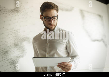 Handsome guy using tablet Stock Photo
