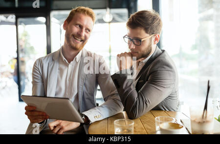 Business colleagues meeting at cafe Stock Photo