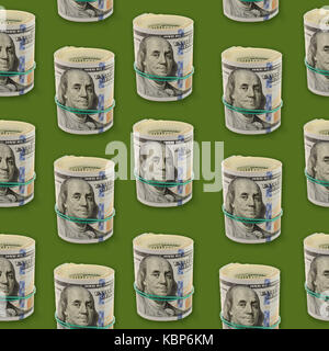 Seamless pattern with plenty rolls of One Hundred Dollar Bills on a green background. Abstract money background Stock Photo