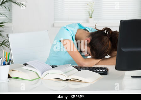 Young female student resting table in home office Stock Photo