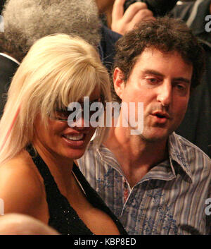 HOLLYWOOD, FL - FEBRUARY 8, 2007: Anna Nicole Smith collaped and died  at The Seminole Hard Rock Hotel and Casino in Hollywood Florida.  She is pictured with Hulk Hogan at a boxing event on January 6, 2007 at the same location   People:  Anna Nicole Smith; Howard K Stern  Transmission Ref:  MNC   Credit: Hoo-Me.com / MediaPunch Stock Photo