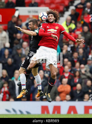 Manchester United's Marouane Fellaini (right) and Crystal Palace's James McArthur battle for the ball during the Premier League match at Old Trafford, Manchester.